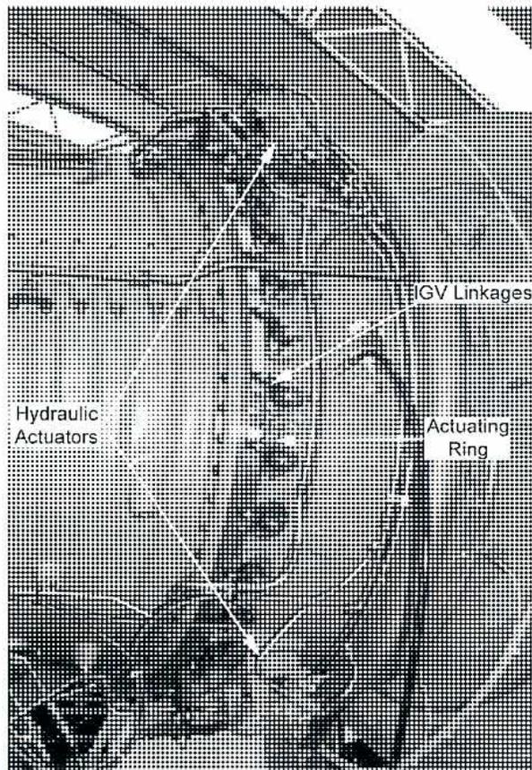 A black and white photograph of a GE Frame 6FA Heavy-Duty Gas Turbine. The image shows the internal components of the turbine with labels and arrows pointing to them: 'Air Intake' at the top right, 'Compressor' at the bottom right, 'Combustion Section' in the center, 'Turbine' at the top left, and 'Exhaust' at the bottom left.