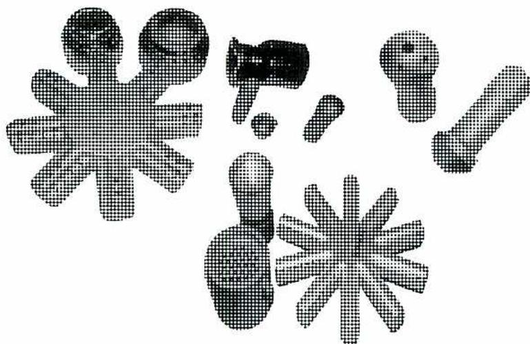 Figure 17: Gas Burner Tips. This image shows six different gas burner tips arranged in a circular fashion. The tips include a star-shaped tip with eight points, a small circular tip, a rectangular tip with rounded ends, a larger rectangular tip, a circular tip with a central hole, and a circular tip with a cross-shaped internal structure.