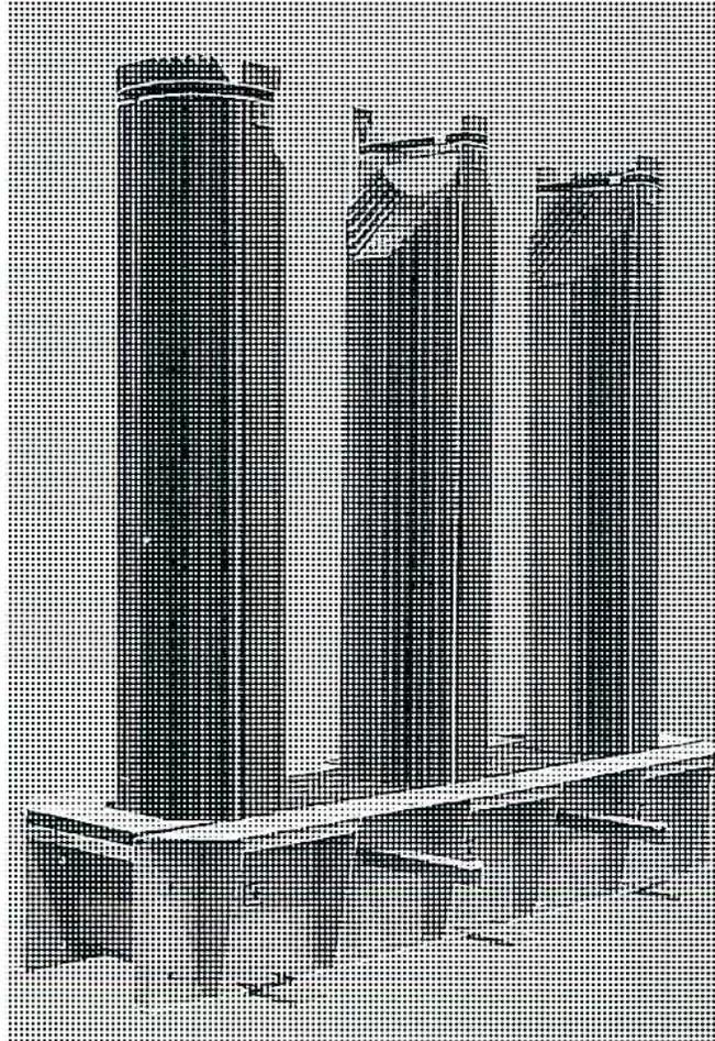 A 3D perspective view of a three-phase shell-type transformer core. It consists of three vertical cylindrical cores of equal height, arranged in a row. Each core has a horizontal flange at its base. The cores are connected by horizontal bars at the top, forming a single continuous magnetic path.